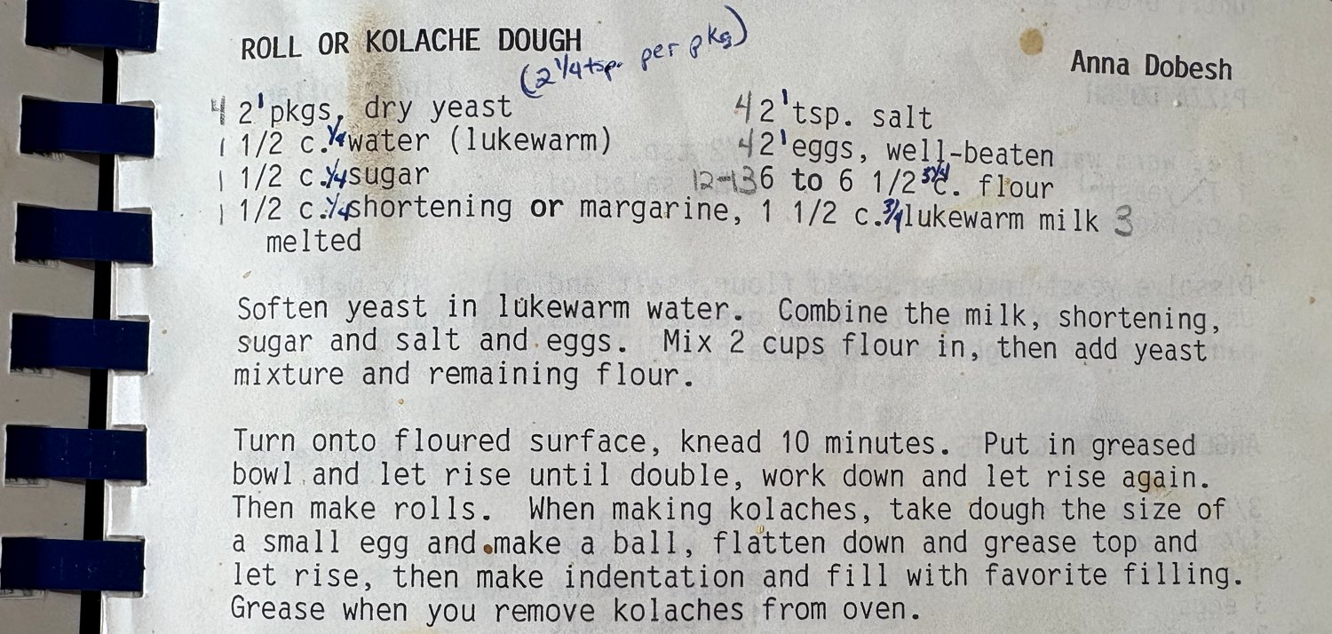 Roll or Kolache Dough, a typed community-cookbook recipe by Anna Dobesh, with handwritten annotations, still in its comb binding